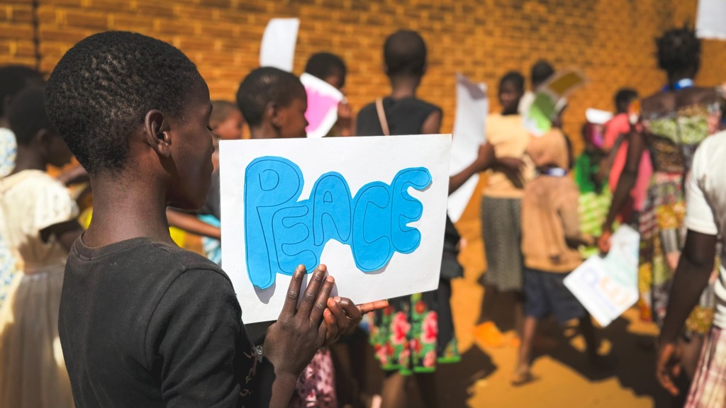 Balaka, Malawi: the Summer School ends with a rally for peace, children and adults marching through the streets of the city